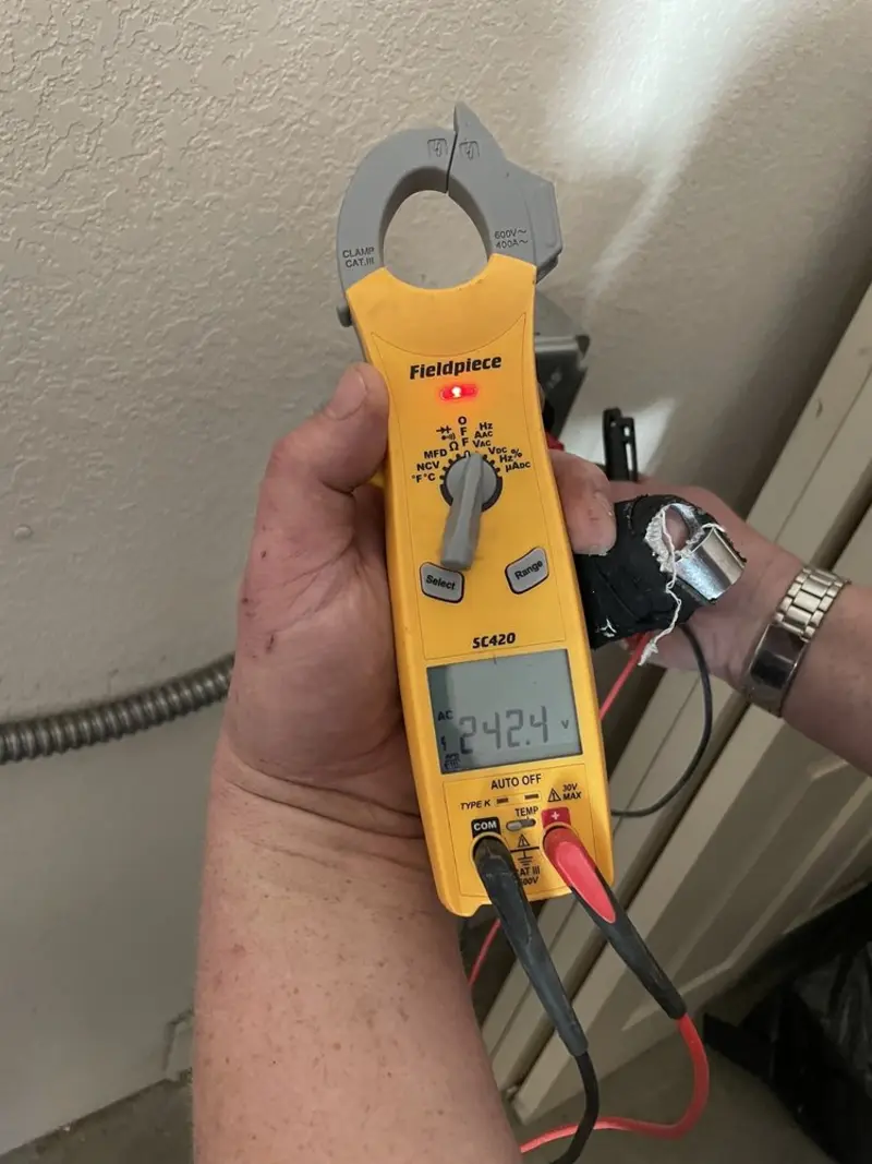 Voltage testing with clamp meter during Recessed Lighting Installation in North Berwick